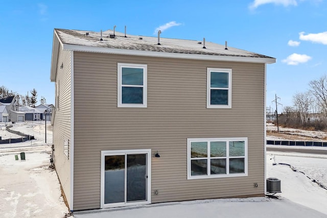 rear view of house with cooling unit