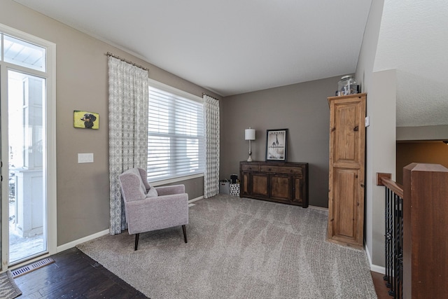 sitting room featuring visible vents, baseboards, and carpet floors