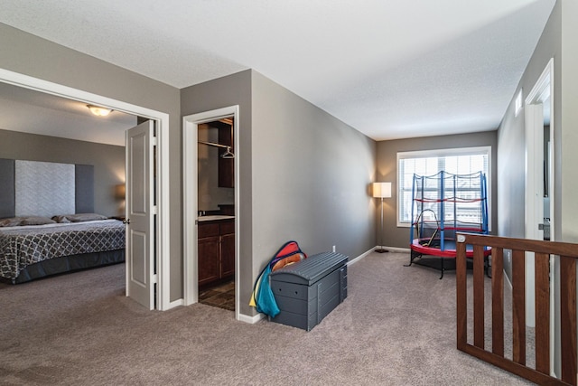 carpeted bedroom with baseboards