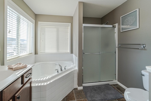 full bath with toilet, a shower stall, baseboards, a bath, and vanity