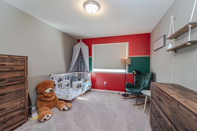 carpeted bedroom featuring baseboards