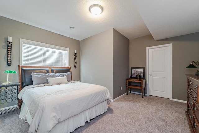 bedroom featuring baseboards and light colored carpet