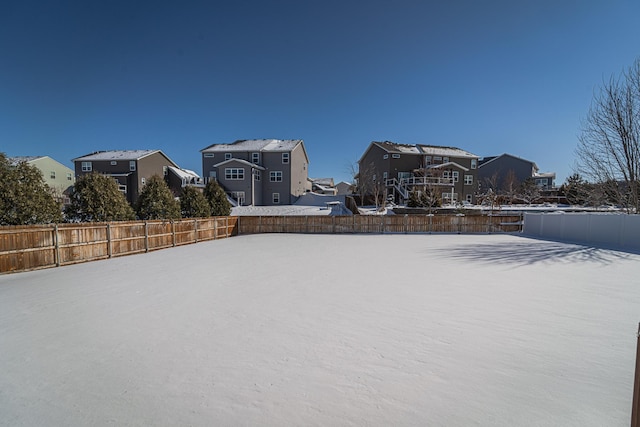 view of yard featuring a residential view and a fenced backyard