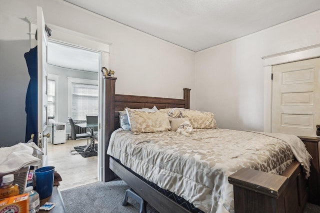 bedroom with wood finished floors