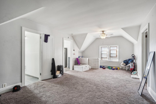 game room featuring vaulted ceiling, carpet flooring, and a ceiling fan