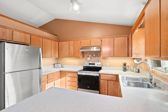 kitchen featuring under cabinet range hood, a sink, appliances with stainless steel finishes, light countertops, and vaulted ceiling