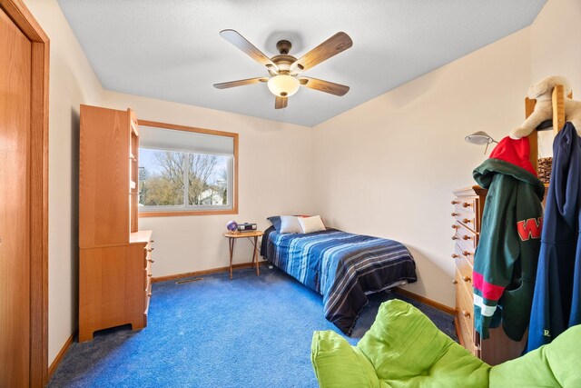 bedroom featuring a ceiling fan, baseboards, and carpet floors