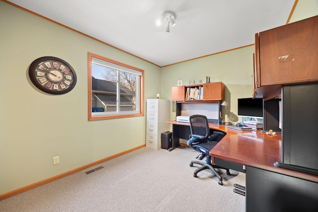 office space with crown molding, light colored carpet, visible vents, and baseboards