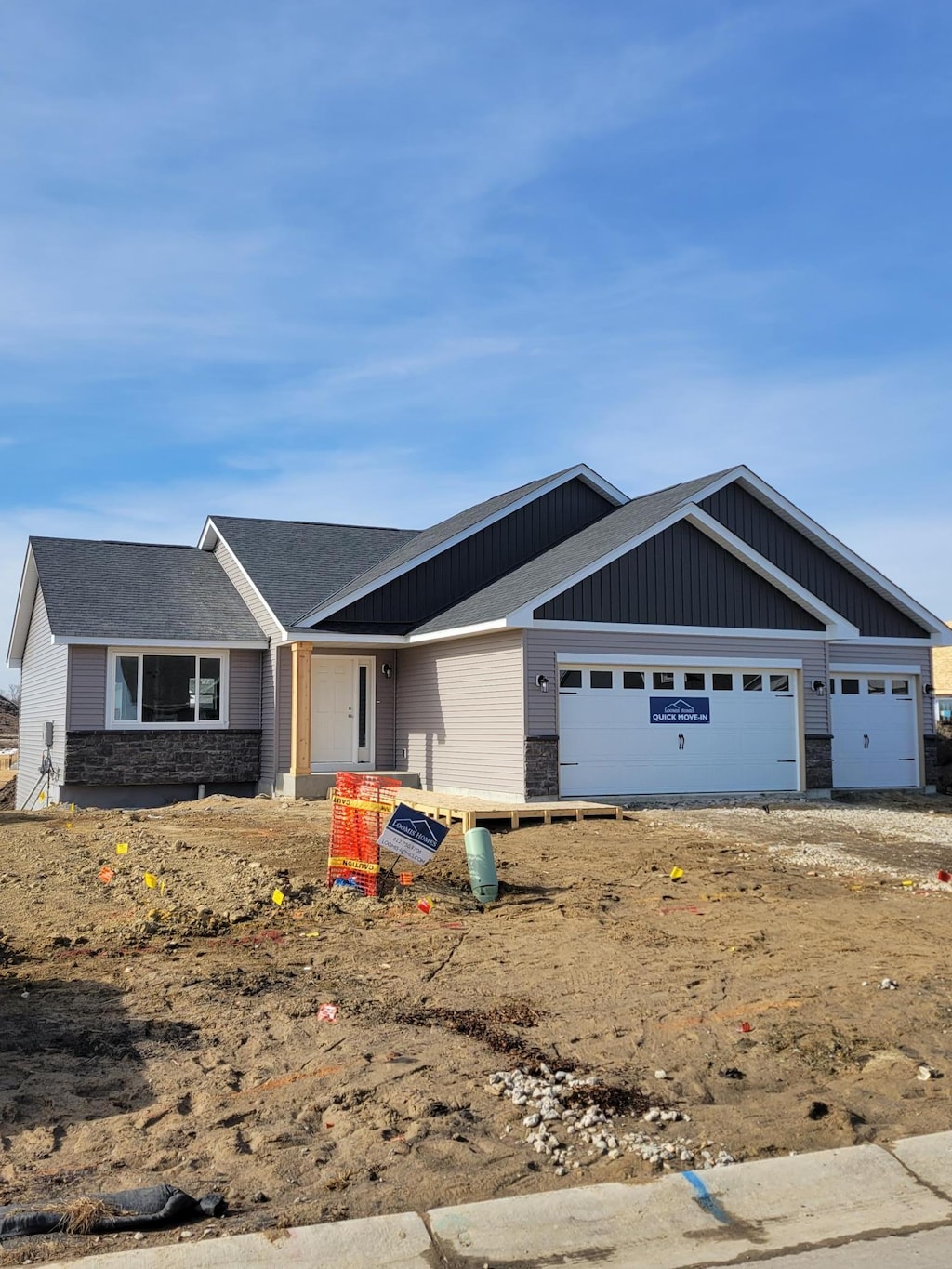 view of front of house with stone siding and an attached garage