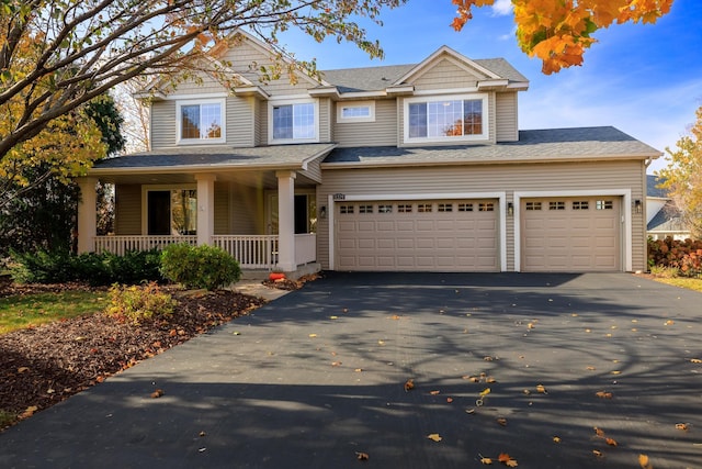 craftsman-style home featuring a porch and driveway