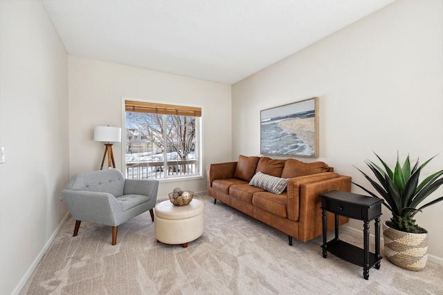 living room featuring carpet flooring and baseboards