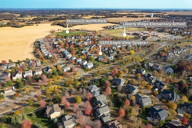 birds eye view of property with a residential view