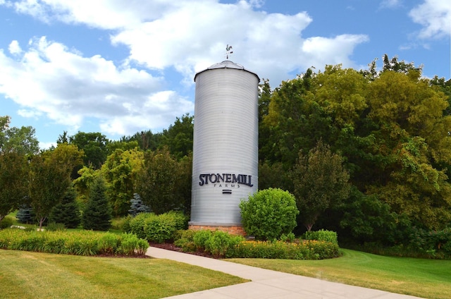 view of home's community with a yard