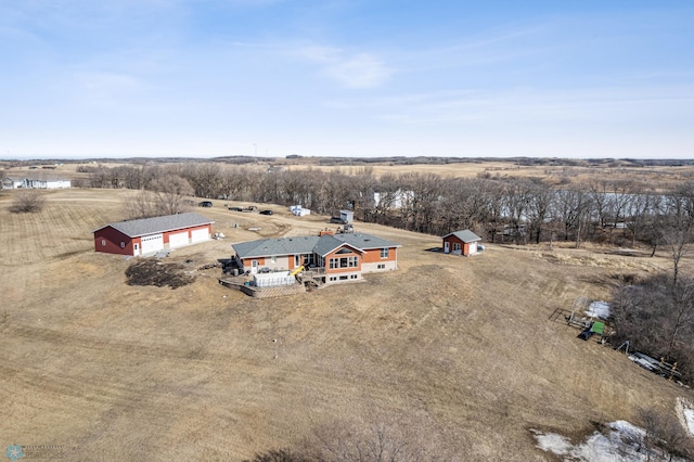 birds eye view of property with a rural view