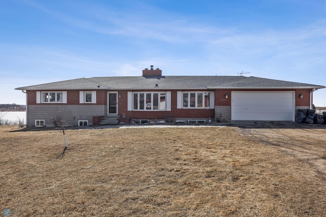 single story home featuring brick siding, entry steps, a front yard, and a garage