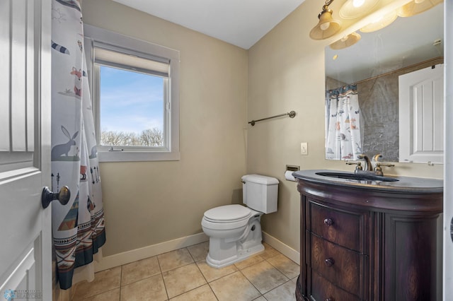 bathroom featuring vanity, a shower with shower curtain, baseboards, tile patterned flooring, and toilet