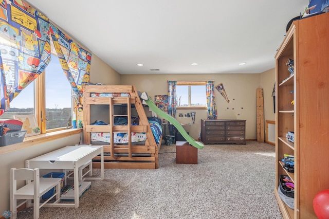 carpeted bedroom with recessed lighting