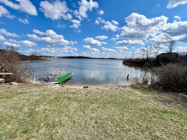 property view of water with a dock