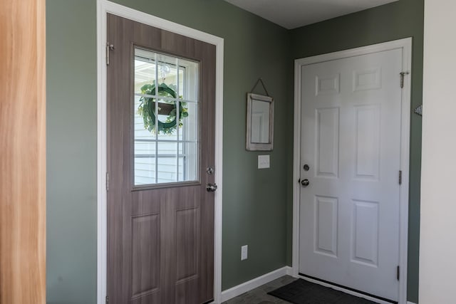 entryway featuring a healthy amount of sunlight and baseboards