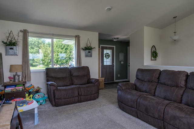 carpeted living room with vaulted ceiling