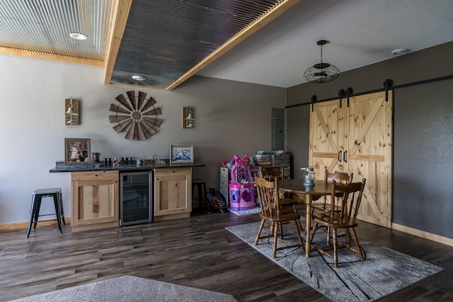 dining space featuring a barn door, wine cooler, baseboards, and dark wood-type flooring