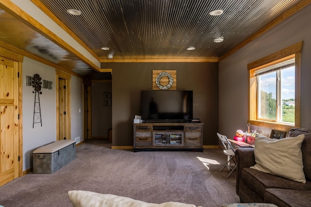 living area with wood ceiling, carpet, baseboards, and ornamental molding