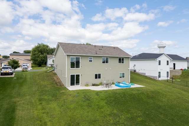 back of house featuring a yard and a patio area