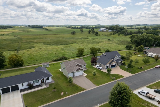 birds eye view of property featuring a rural view