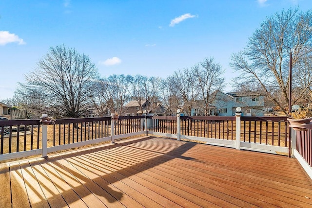 wooden terrace featuring a residential view