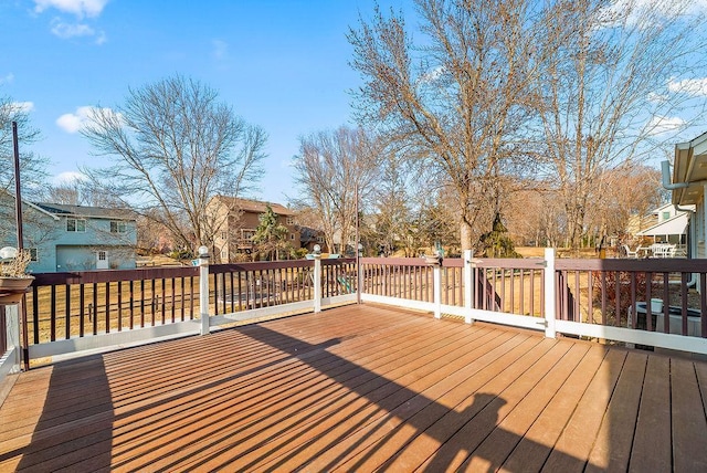 wooden terrace with a residential view