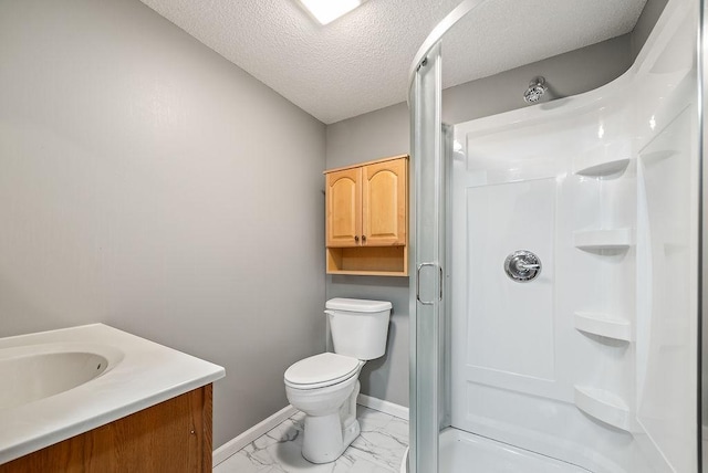 bathroom featuring toilet, marble finish floor, a textured ceiling, a shower stall, and baseboards