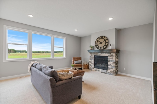 carpeted living room with recessed lighting, a fireplace, and baseboards