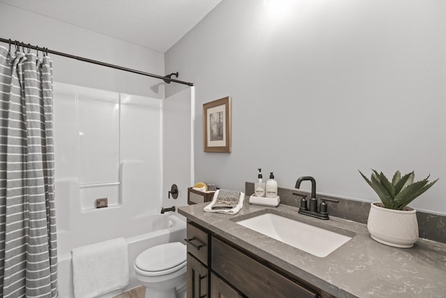 bathroom featuring toilet, vanity, and shower / bath combo