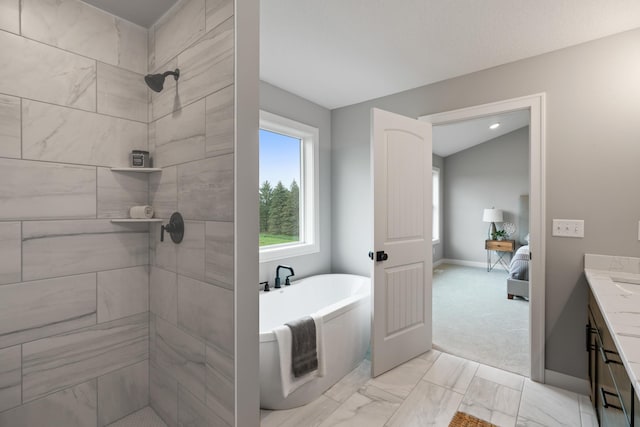 full bathroom with marble finish floor, a tile shower, baseboards, a soaking tub, and vanity