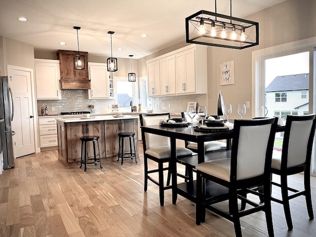 9551 230th St E, Lakeville, MN 55044 - dining room with light wood finished floors, plenty of natural light, recessed lighting, and a chandelier