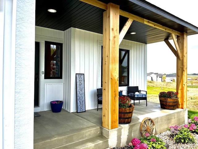 9551 230th St E, Lakeville, MN 55044 - entrance to property featuring covered porch and board and batten siding