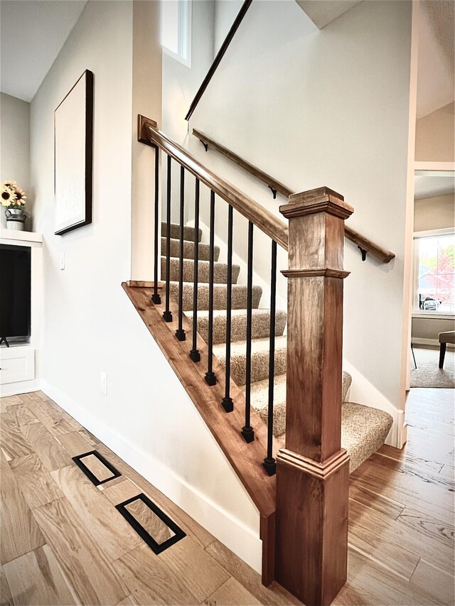 9551 230th St E, Lakeville, MN 55044 - staircase with baseboards and wood finished floors