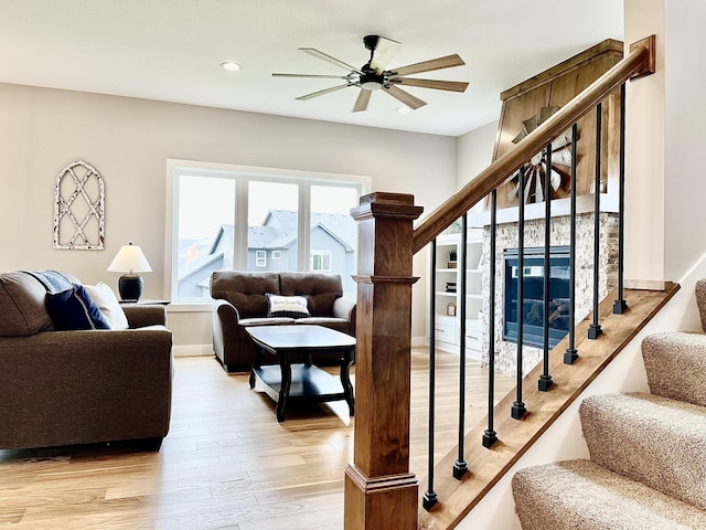 9551 230th St E, Lakeville, MN 55044 - living room with stairway, light wood-style floors, a ceiling fan, and recessed lighting