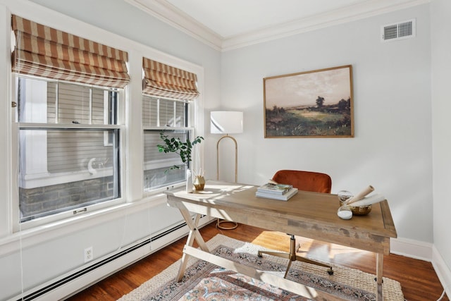 office area featuring visible vents, crown molding, baseboards, wood finished floors, and a baseboard radiator