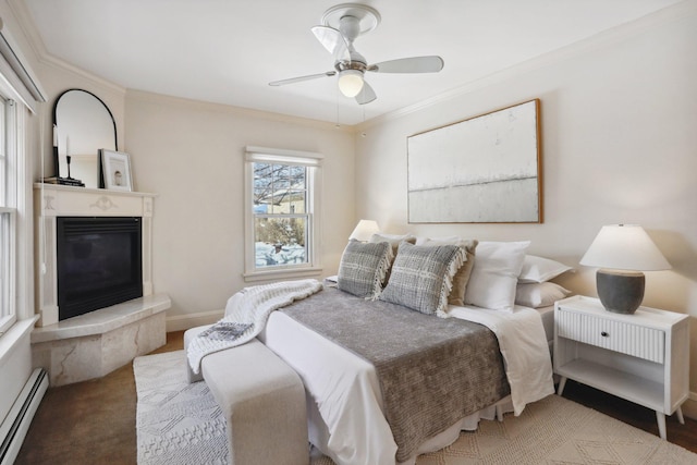 carpeted bedroom featuring a glass covered fireplace, crown molding, a baseboard radiator, baseboards, and ceiling fan