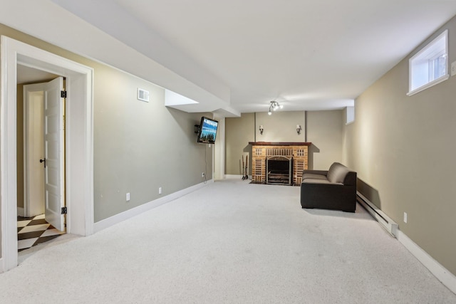 sitting room featuring baseboards, visible vents, carpet floors, a fireplace, and baseboard heating