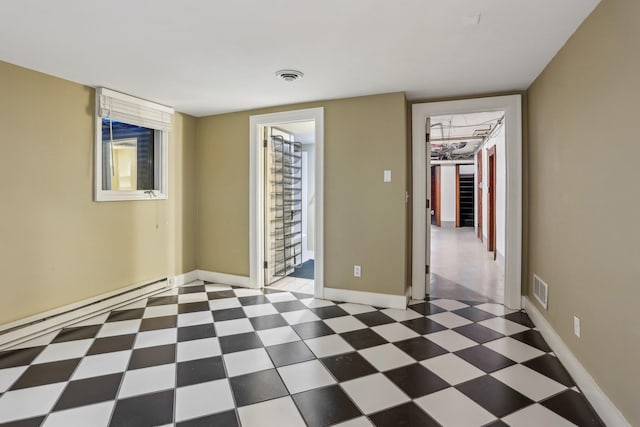 unfurnished room with tile patterned floors, visible vents, and baseboards