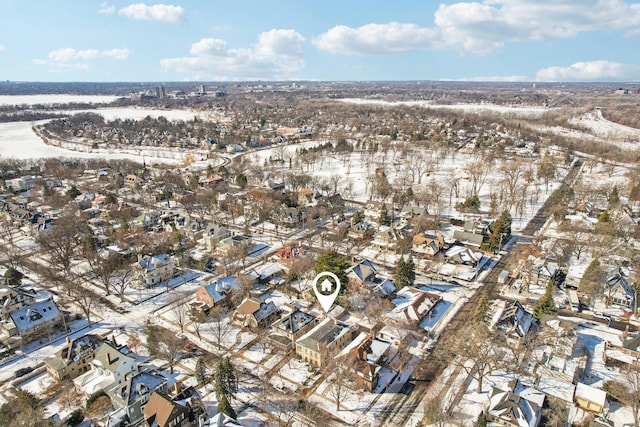 snowy aerial view featuring a residential view