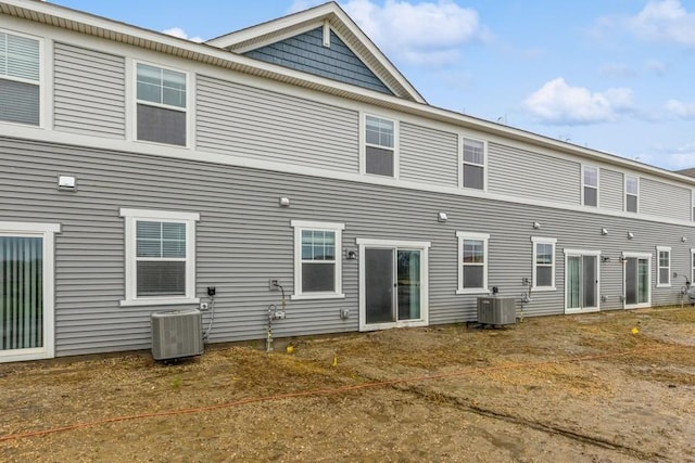 back of house featuring central AC unit