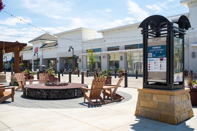 view of community with an outdoor fire pit