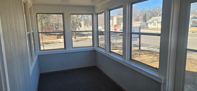 unfurnished sunroom with a residential view