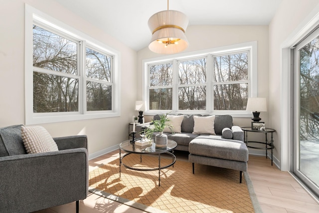 sunroom / solarium with vaulted ceiling