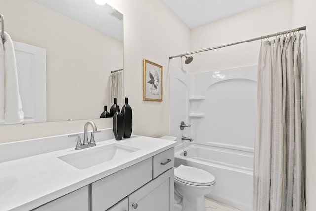 bathroom featuring visible vents, toilet, marble finish floor, shower / tub combo, and vanity