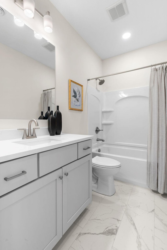 full bathroom featuring vanity, marble finish floor, visible vents, and shower / tub combo with curtain