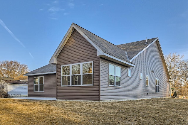 view of home's exterior with a lawn